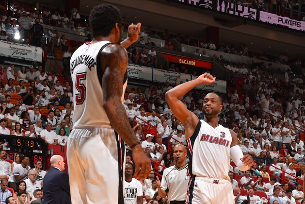 MIAMI,FL - APRIL 17:  Amar'e Stoudemire #5 and Dwyane Wade #3 of the Miami Heat give each other pounds against the Charlotte Hornets during the Eastern Conference playoffs First Round Game One on April 17, 2016 at the American Airlines Arena in Miami, Florida. NOTE TO USER: User expressly acknowledges and agrees that, by downloading and/or using this Photograph, user is consenting to the terms and conditions of the Getty Images License Agreement. Mandatory Copyright Notice: Copyright 2016 NBAE (Photo by Jesse D. Garrabrant/NBAE via Getty Images)