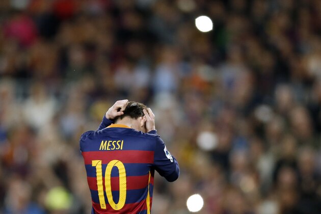 FC Barcelona's Lionel Messi reacts after missing a chance during a Spanish La Liga soccer match between FC Barcelona and Valencia at the Camp Nou stadium in Barcelona, Spain, Sunday, April 17, 2016. FC Barcelona lost the match 1-2. (AP Photo/Manu Fernandez)