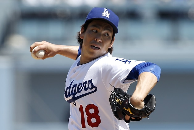 Los Angeles Dodgers starting pitcher Kenta Maeda throws to the plate against the Arizona Diamondbacks during the first inning of a baseball game in Los Angeles, Tuesday, April 12, 2016. (AP Photo/Alex Gallardo)