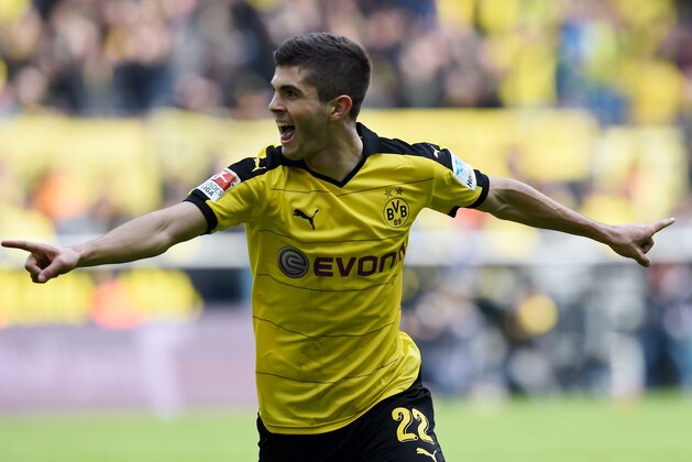 Dortmund's midfielder Christian Pulisic celebrates scoring the 1-0 goal during the German Bundesliga first division football match BVB Borussia Dortmund vs Hamburg SV in Dortmund, western Germany, on April 17, 2016. 

 / AFP / PATRIK STOLLARZ / RESTRICTIONS: DURING MATCH TIME: DFL RULES TO LIMIT THE ONLINE USAGE TO 15 PICTURES PER MATCH AND FORBID IMAGE SEQUENCES TO SIMULATE VIDEO. == RESTRICTED TO EDITORIAL USE == FOR FURTHER QUERIES PLEASE CONTACT DFL DIRECTLY AT + 49 69 650050
        (Photo credit should read PATRIK STOLLARZ/AFP/Getty Images)