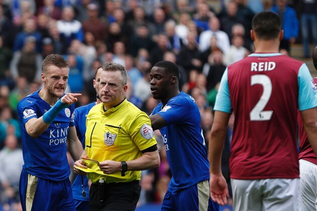 Leicester City's English striker Jamie Vardy (L) reacts after referee Jonathan Moss (2L) showed Vardy his second yellow card for simulation to send him off during the English Premier League football match between Leicester City and West Ham United at King Power Stadium in Leicester, central England on April 17, 2016. / AFP / ADRIAN DENNIS / RESTRICTED TO EDITORIAL USE. No use with unauthorized audio, video, data, fixture lists, club/league logos or 'live' services. Online in-match use limited to 75 images, no video emulation. No use in betting, games or single club/league/player publications.  /         (Photo credit should read ADRIAN DENNIS/AFP/Getty Images)