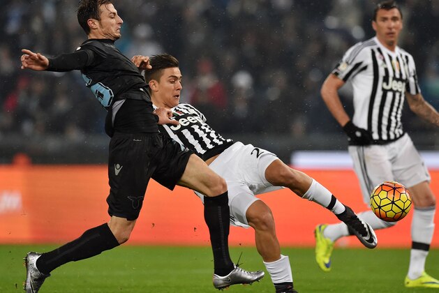 ROME, ITALY - JANUARY 20: Stefan Radu of SS Lazio and Paulo Dybala of Juventus FC in action during the TIM Cup between SS Lazio and Juventus FC at Stadio Olimpico on January 20, 2016 in Rome, Italy.  (Photo by Giuseppe Bellini/Getty Images)