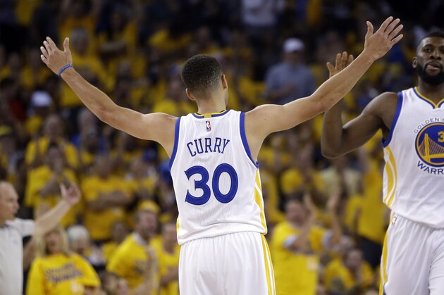 Golden State Warriors' Stephen Curry (30) and Festus Ezeli during Game 1 of a first-round NBA basketball playoff series against the Houston Rockets Saturday, April 16, 2016, in Oakland, Calif. (AP Photo/Marcio Jose Sanchez) Golden State Warriors' Stephen Curry (30) and Festus Ezeli during Game 1 of a first-round NBA basketball playoff series against the Houston Rockets Saturday, April 16, 2016, in Oakland, Calif. (AP Photo/Marcio Jose Sanchez)