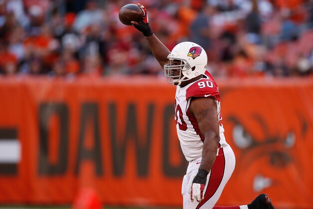 CLEVELAND, OH - NOVEMBER 01: Cory Redding #90 of the Arizona Cardinals celebrates a fourth quarter fumble recovery while playing the Cleveland Browns at FirstEnergy Stadium on November 1, 2015 in Cleveland, Ohio. Arizona won the game 34-20. (Photo by Gregory Shamus/Getty Images)