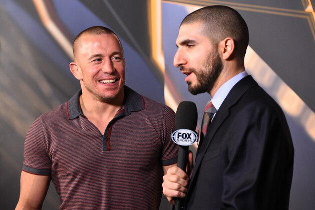 MONTREAL, QC - APRIL 24:  Former UFC welterweight champion Georges St-Pierre (L) is interviewed by MMA journalist Ariel Helwani before the UFC 186 weigh-in event at Metropolis on April 24, 2015 in Montreal, Quebec, Canada. (Photo by Jeff Bottari/Zuffa LLC/Zuffa LLC via Getty Images)