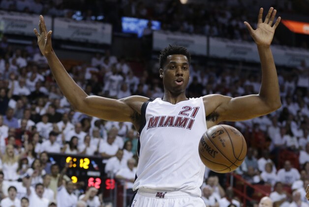 Miami Heat center Hassan Whiteside (21) reacts after dunking the ball during the second half of Game 1 of a first-round NBA basketball playoff series against the Charlotte Hornets, Sunday, April 17, 2016, in Miami. The Heat defeated the Hornets 123-91. (AP Photo/Lynne Sladky)