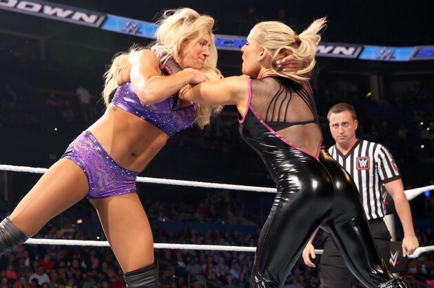 IMAGE DISTRIBUTED FOR WWE - WWE women's champion Charlotte celebrates her victory at WWE WrestleMania 32 at AT&T Stadium on Sunday, April 3, 2016, in Arlington, Texas. (Brandon Wade/AP Images for WWE)