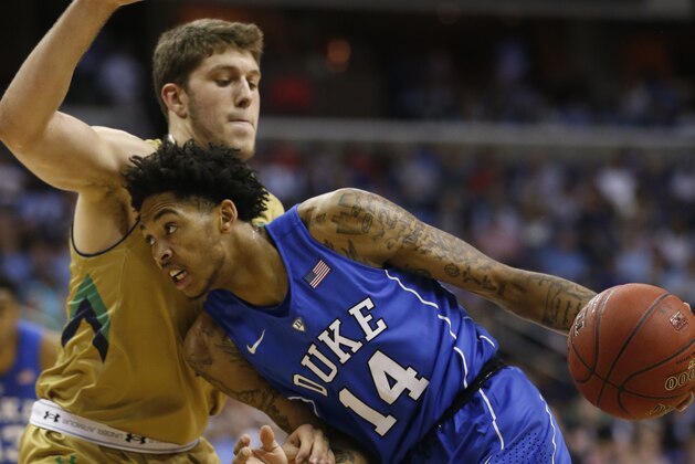 Duke guard Brandon Ingram (14) tries to drive to the basket in front of Notre Dame forward Matt Ryan (4) during the first half of an NCAA college basketball game in the Atlantic Coast Conference tournament, in Washington , Thursday, March 10, 2016. (AP Photo/Steve Helber)