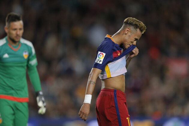 FC Barcelona's Neymar reacts after missing a chance during a Spanish La Liga soccer match between FC Barcelona and Valencia at the Camp Nou stadium in Barcelona, Spain, Sunday, April 17, 2016. (AP Photo/Manu Fernandez)