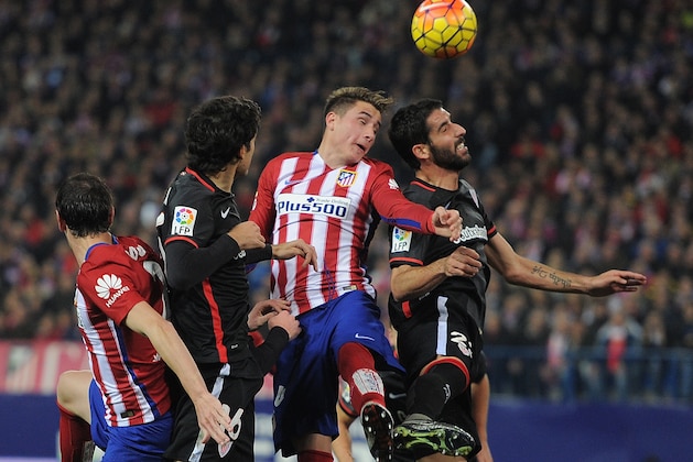 MADRID, SPAIN - DECEMBER 13:   Jose Maria Gimenez of Club Atletico de Madrid goes for a high ball against Raul Garcia of Athletic Club during the La Liga match between Club Atletico de Madrid and Athletic Club at Vicente Calderon Stadium on December 13, 2015 in Madrid, Spain.  (Photo by Denis Doyle/Getty Images)