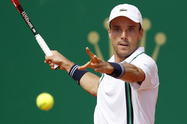 Roberto Bautista Agut of Spain returns to his compatriot Albert Ramos-Vinolas during their Monte-Carlo ATP Masters Series tournament tennis match, on April 11, 2016 in Monaco.    AFP PHOTO / JEAN CHRISTOPHE MAGNENET / AFP / Jean-Christophe MAGNENET        (Photo credit should read JEAN-CHRISTOPHE MAGNENET/AFP/Getty Images)