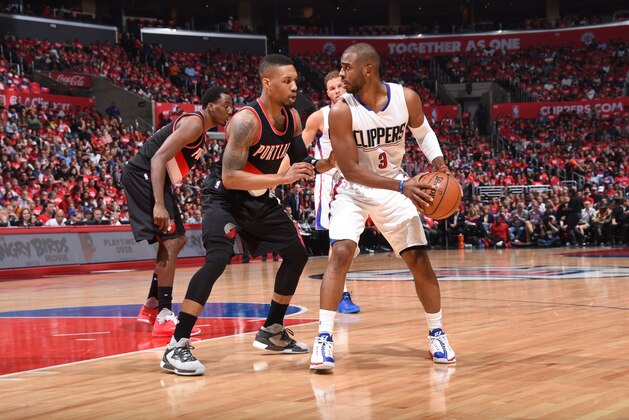 LOS ANGELES, CA - APRIL 17:  Chris Paul #3 of the Los Angeles Clippers handles the ball against Damian Lillard #0 of the Portland Trail Blazers in Game One of the Western Conference Quarterfinals during the 2016 NBA Playoffs on April 17, 2016 at STAPLES Center in Los Angeles, California. NOTE TO USER: User expressly acknowledges and agrees that, by downloading and/or using this Photograph, user is consenting to the terms and conditions of the Getty Images License Agreement. Mandatory Copyright Notice: Copyright 2016 NBAE (Photo by Andrew D. Bernstein/NBAE via Getty Images)