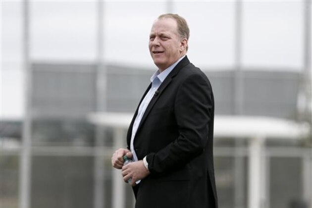 FILE- In this Feb. 25, 2015, file photo, baseball broadcast analyst and former Boston Red Sox pitcher Curt Schilling watches as the Red Sox workout at baseball spring training in Fort Myers Fla. Boston Mayor Martin J. Walsh wants to ban chewing tobacco in sports venues across the city. The mayor is expected to discuss a proposed new ordinance Wednesday, Aug. 5. Public health officials, advocates, local youth and Schilling are expected to attend. (AP Photo/Tony Gutierrez, File)