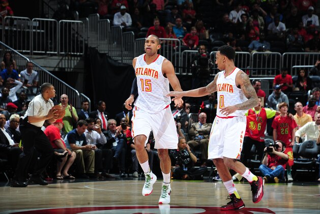 ATLANTA, GA - APRIL 19:  Al Horford #15 and Jeff Teague #0 of the Atlanta Hawks during the game against the Boston Celtics in Game Two of the Eastern Conference Quarterfinals during the 2016 NBA Playoffs on April 19, 2016 at Philips Arena in Atlanta, Georgia.  NOTE TO USER: User expressly acknowledges and agrees that, by downloading and/or using this Photograph, user is consenting to the terms and conditions of the Getty Images License Agreement. Mandatory Copyright Notice: Copyright 2016 NBAE (Photo by Scott Cunningham/NBAE via Getty Images)
