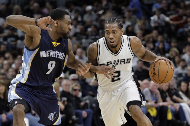 San Antonio Spurs forward Kawhi Leonard (2) drives around Memphis Grizzlies guard Tony Allen (9) during Game 2 of a first-round NBA basketball playoff series, Tuesday, April 19, 2016, in San Antonio, Texas. (AP Photo/Eric Gay)