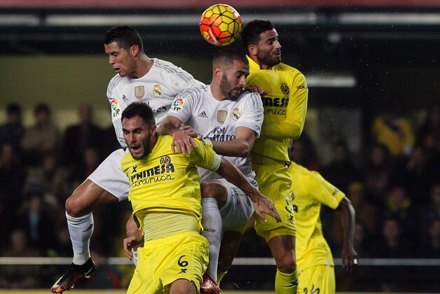 Real Madrid's French forward Karim Benzema and Real Madrid's Portuguese forward Cristiano Ronaldo (L) vie with Villarreal's defender Victor Ruiz and Villarreal's Argentinian defender Mateo Musacchio (R) during the Spanish league football match Villarreal CF vs Real Madrid CF at El Madrigal stadium in Villareal on December 13, 2015. / AFP / JOSE JORDAN (Photo credit should read JOSE JORDAN/AFP/Getty Images) Real Madrid's French forward Karim Benzema and Real Madrid's Portuguese forward Cristiano Ronaldo (L) vie with Villarreal's defender Victor Ruiz and Villarreal's Argentinian defender Mateo Musacchio (R) during the Spanish league football match Villarreal CF vs Real Madrid CF at El Madrigal stadium in Villareal on December 13, 2015. / AFP / JOSE JORDAN (Photo credit should read JOSE JORDAN/AFP/Getty Images)