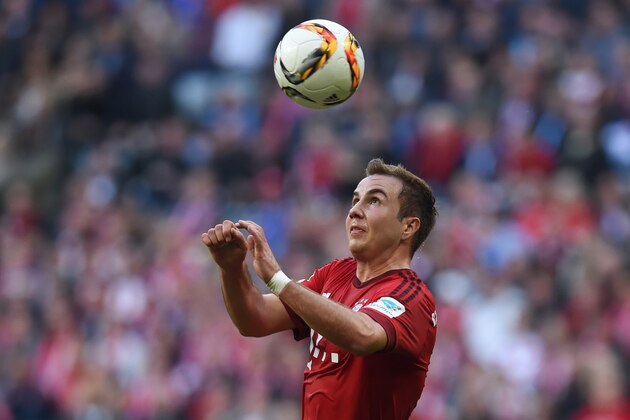 Bayern Munich's midfielder Mario Goetze heads the ball during the German first division Bundesliga football match FC Bayern Munich vs Schalke 04 in Munich, southern Germany, on April 16, 2016.
Bayern Munich won the match 3-0. / AFP / CHRISTOF STACHE / RESTRICTIONS: DURING MATCH TIME: DFL RULES TO LIMIT THE ONLINE USAGE TO 15 PICTURES PER MATCH AND FORBID IMAGE SEQUENCES TO SIMULATE VIDEO. == RESTRICTED TO EDITORIAL USE == FOR FURTHER QUERIES PLEASE CONTACT DFL DIRECTLY AT + 49 69 650050
        (Photo credit should read CHRISTOF STACHE/AFP/Getty Images)