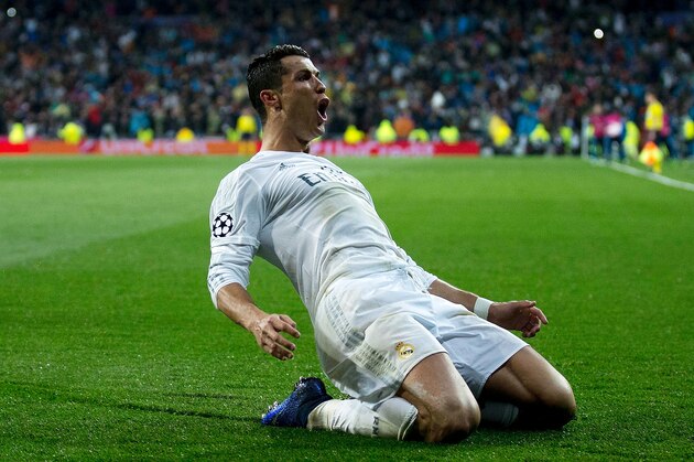 MADRID, SPAIN - APRIL 12:  Cristiano Ronaldo of Real Madrid celebrates as he scores their third goal from a free kick and completes his hat trick during the UEFA Champions League quarter final second leg match between Real Madrid CF and VfL Wolfsburg at Estadio Santiago Bernabeu on April 12, 2016 in Madrid, Spain.  (Photo by Gonzalo Arroyo Moreno/Getty Images)