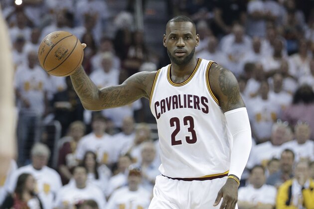 Cleveland Cavaliers' LeBron James brings the ball downcourt in the first half in Game 1 of a first-round NBA basketball playoff series against the Detroit Pistons, Sunday, April 17, 2016, in Cleveland. (AP Photo/Tony Dejak)