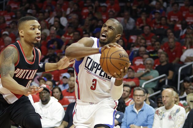 Los Angeles Clippers' Chris Paul, right, is pressured by Portland Trail Blazers' Damian Lillard in the first half in Game 1 of a first-round NBA basketball playoff series, on Sunday, April 17, 2016, in Los Angeles. (AP Photo/Jae C. Hong)
