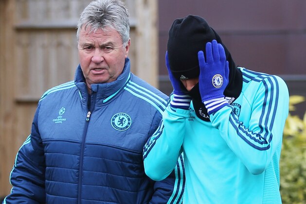 COBHAM, ENGLAND - MARCH 08:  Guus Hiddink manager of Chelsea in discussion with Kenedy during a Chelsea training session ahead of their UEFA Champions League round of 16 second leg match against Paris Saint-Germain at Chelsea Training Ground on March 8, 2016 in Cobham, England.  (Photo by Alex Morton/Getty Images)