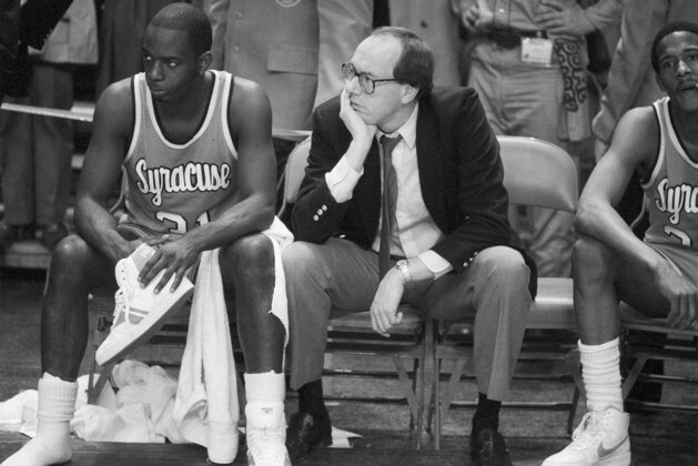Syracuse coach Jim Boeheim, right, and Syracuse player Dwayne Washington (31) watch as Georgetown University took control in overtime of the Big East Conference championship basketball game in New York at Madison Square Garden, March 10, 1984, to defeat Syracuse 82-71. (AP Photo/Ray Stubblebine)
