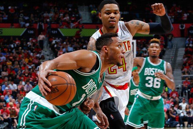 ATLANTA, GA - APRIL 19:  Evan Turner #11 of the Boston Celtics drives againts Kent Bazemore #24 of the Atlanta Hawks in Game Two of the Eastern Conference Quarterfinals during the 2016 NBA Playoffs at Philips Arena on April 19, 2016 in Atlanta, Georgia.  NOTE TO USER User expressly acknowledges and agrees that, by downloading and or using this photograph, user is consenting to the terms and conditions of the Getty Images License Agreement.  (Photo by Kevin C. Cox/Getty Images)