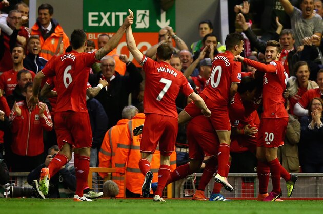 LIVERPOOL, ENGLAND - APRIL 20: Liverpool players celebrate following Divock Origi's opening goal during the Barclays Premier League match between Liverpool and Everton at Anfield, April 20, 2016, Liverpool, England  (Photo by Clive Brunskill/Getty Images)