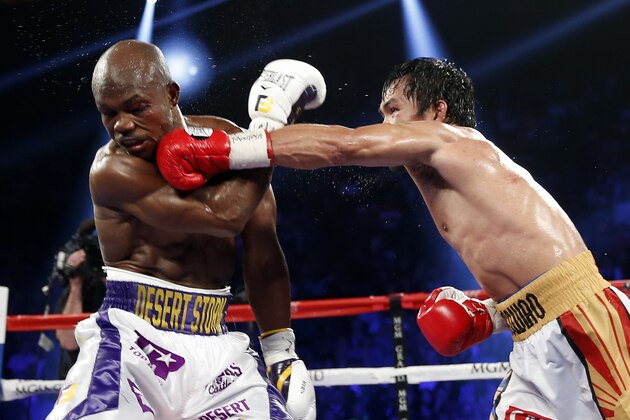 Manny Pacquiao, of the Philippines, fights Timothy Bradley during a welterweight title boxing match Saturday, April 9, 2016, in Las Vegas in Las Vegas. (AP Photo/Isaac Brekken)