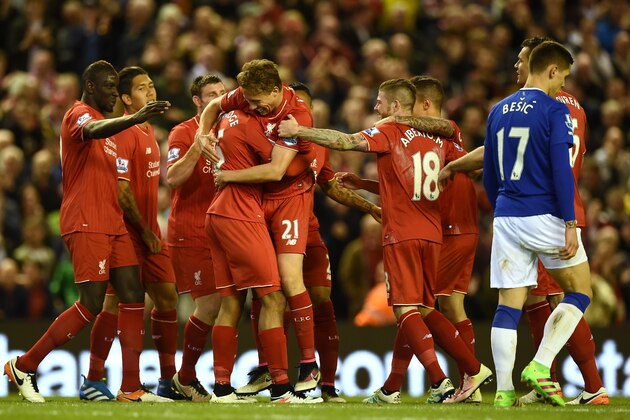 Liverpool's English striker Daniel Sturridge (C) celebrates with teammates after scoring during the English Premier League football match between Liverpool and Everton at Anfield in Liverpool, north west England on April 20, 2016. / AFP / PAUL ELLIS / RESTRICTED TO EDITORIAL USE. No use with unauthorized audio, video, data, fixture lists, club/league logos or 'live' services. Online in-match use limited to 75 images, no video emulation. No use in betting, games or single club/league/player publications.  /         (Photo credit should read PAUL ELLIS/AFP/Getty Images)