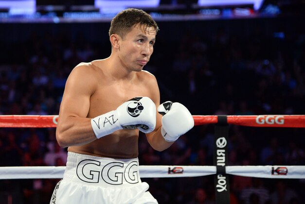 Jul 26, 2014; New York, NY, USA; Gennady Golovkin (white gloves) and Daniel Geale (not pictured) box during their middleweight championship bout at Madison Square Garden. Golovkin won via third round knockout. Mandatory Credit: Joe Camporeale-USA TODAY Sports