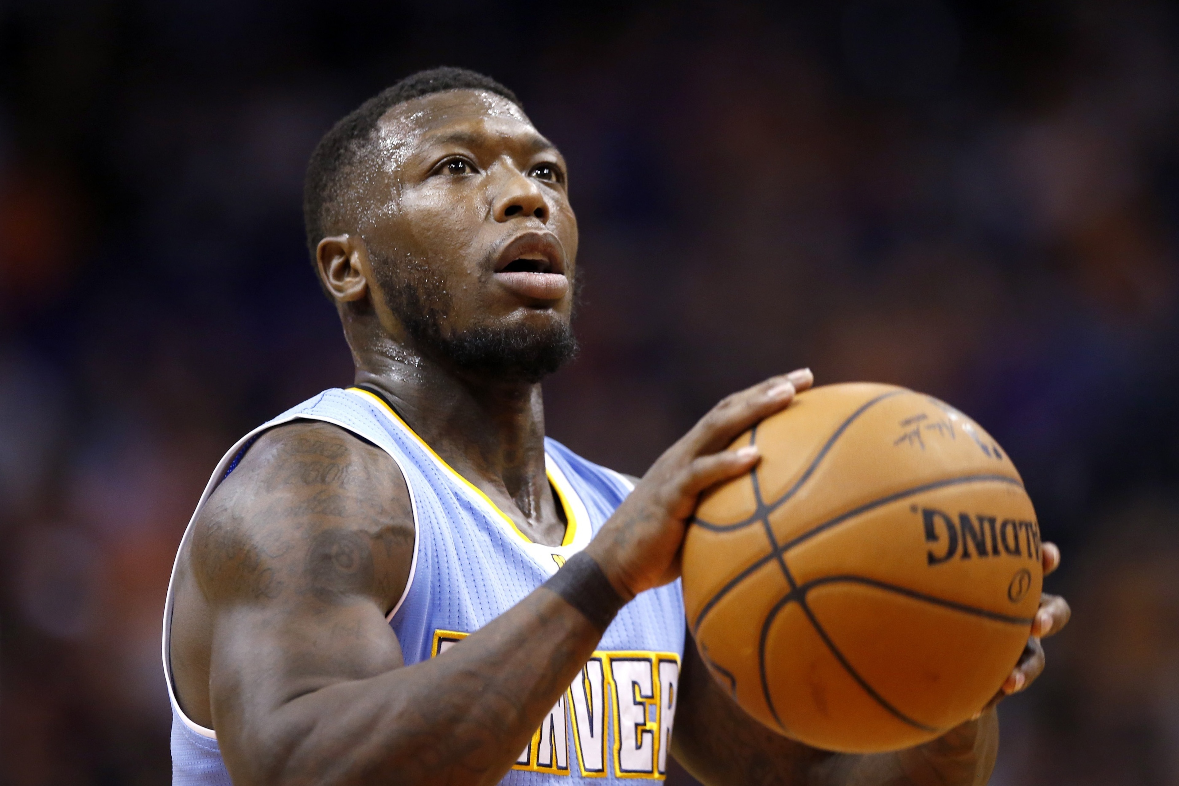 Denver Nuggets' Nate Robinson shoots a foul shot during the first half of an NBA basketball game against the Phoenix Suns Wednesday, Nov. 26, 2014, in Phoenix. (AP Photo/Ross D. Franklin) Denver Nuggets' Nate Robinson shoots a foul shot during the first half of an NBA basketball game against the Phoenix Suns Wednesday, Nov. 26, 2014, in Phoenix. (AP Photo/Ross D. Franklin)