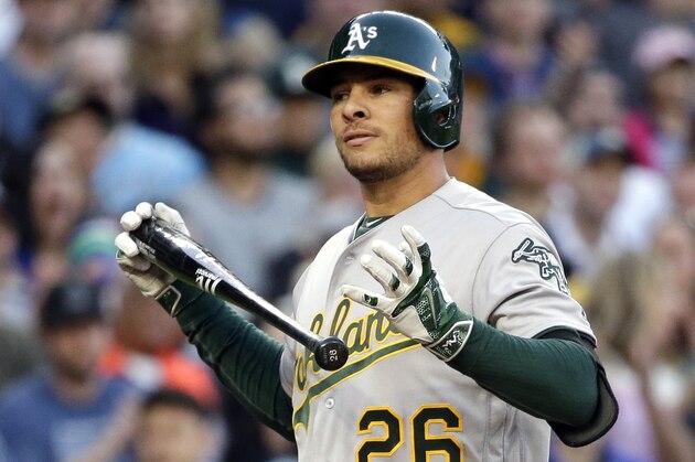 Oakland Athletics' Danny Valencia in action against the Seattle Mariners in a baseball game Saturday, April 9, 2016, in Seattle. (AP Photo/Elaine Thompson)