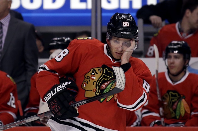 Chicago Blackhawks right wing Patrick Kane adjusts his helmet during the first period in Game 4 of an NHL hockey first-round Stanley Cup playoff series against the St. Louis Blues Tuesday, April 19, 2016, in Chicago. (AP Photo/Nam Y. Huh)