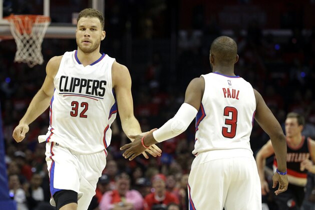 Los Angeles Clippers' Chris Paul, right, celebrates his 3-point basket with Blake Griffin in the second half in Game 1 of a first-round NBA basketball playoff series against the Portland Trail Blazers, Sunday, April 17, 2016, in Los Angeles. The Clippers won 115-95. (AP Photo/Jae C. Hong)