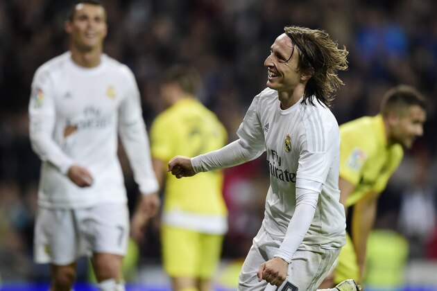 Real Madrid's Croatian midfielder Luka Modric celebrates after scoring a goal during the Spanish league football match Real Madrid CF vs Villarreal CF at the Santiago Bernabeu stadium in Madrid on April 20, 2016. / AFP / JAVIER SORIANO        (Photo credit should read JAVIER SORIANO/AFP/Getty Images)