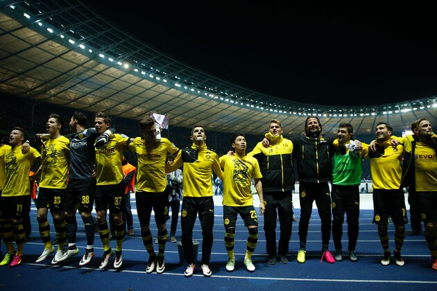 Dortmund playes celebrate after the German Cup (DFB Pokal) semi-final football match Hertha Berlin v Borussia Dortmund at the Olympic stadium in Berlin on April 20, 2016.
Dortmund won the match 0-3 and will face Bayern Munich in the final. / AFP / ODD ANDERSEN / RESTRICTIONS: ACCORDING TO DFB RULES IMAGE SEQUENCES TO SIMULATE VIDEO IS NOT ALLOWED DURING MATCH TIME. MOBILE (MMS) USE IS NOT ALLOWED DURING AND FOR FURTHER TWO HOURS AFTER THE MATCH. == RESTRICTED TO EDITORIAL USE == FOR MORE INFORMATION CONTACT DFB DIRECTLY AT +49 69 67880

 /         (Photo credit should read ODD ANDERSEN/AFP/Getty Images)