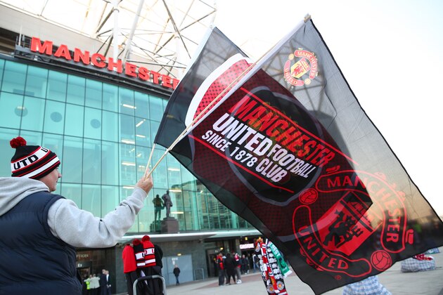 MANCHESTER, ENGLAND - MARCH 17:  A supporter arrives at the ground prior to the UEFA Europa League round of 16, second leg match between Manchester United and Liverpool at Old Trafford on March 17, 2016 in Manchester, England.  (Photo by Clive Brunskill/Getty Images)