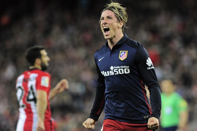 Atletico Madrid's forward Fernando Torres (R) celebrates after scoring a goal during the Spanish league football match Athletic Club vs Atletico de Madrid at the San Mames stadium in Bilbao on April 20, 2016. / AFP / ANDER GILLENEA        (Photo credit should read ANDER GILLENEA/AFP/Getty Images)