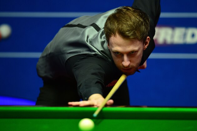 SHEFFIELD, ENGLAND - APRIL 21:  Judd Trump of England plays a shot during his first round match against Liang Wenbo of China on day six of the World Snooker Championship at The Crucible Theatre on April 21, 2016 in Sheffield, England.  (Photo by Dan Mullan/Getty Images)