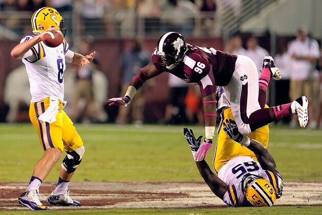STARKVILLE, MS - OCTOBER 05:  Chris Jones #96 of the Mississippi State Bulldogs pressures Zach Mettenberger #8 of the LSU Tigers during a game at Davis Wade Stadium on October 5, 2013 in Starkville, Mississippi.  LSU won the game 59-26.  (Photo by Stacy Revere/Getty Images)