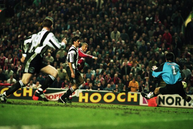 3 Apr 1996:  Stan Collymore of Liverpool scores a dramatic last minute winning goal during the FA Carling Premiership match between Liverpool and Newcastle United played at Anfield, in Liverpool, England. Liverpool won the match 4-3. \ Mandatory Credit: Stu Forster/Getty Images