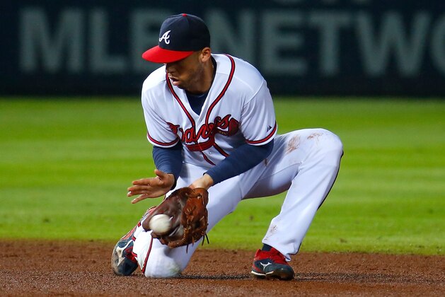 ATLANTA, GA - OCTOBER 01:  Andrelton Simmons #19 of the Atlanta Braves scoops up a force out hit by Bryce Harper #34 of the Washington Nationals in the eighth inning at Turner Field on October 1, 2015 in Atlanta, Georgia.  (Photo by Kevin C. Cox/Getty Images)