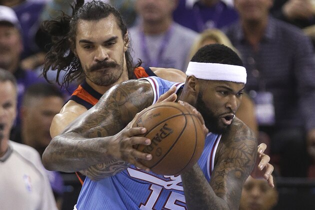 Sacramento Kings center DeMarcus Cousins, right, goes to the basket against Oklahoma City Thunder center Steven Adams during the first quarter of an NBA basketball game Saturday, April 9, 2016, in Sacramento, Calif. (AP Photo/Rich Pedroncelli)