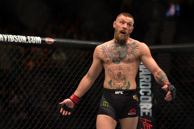 LAS VEGAS, NV - MARCH 5:   Conor McGregor mocks Nate Diaz in their welterweight bout during the UFC 196 in the MGM Grand Garden Arena on March 5, 2016 in Las Vegas, Nevada. (Photo by Brandon Magnus/Zuffa LLC/Zuffa LLC via Getty Images)
