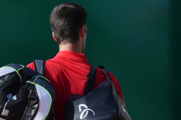 Serbia's Novak Djokovic leaves the court after being defeated by Czech Republic's Jiri Vesely  in their tennis match at the Monte-Carlo ATP Masters Series tournament, on April 13, 2016 in Monaco.  AFP PHOTO / JEAN-CHRISTOPHE MAGNENET / AFP / Jean-Christophe MAGNENET        (Photo credit should read JEAN-CHRISTOPHE MAGNENET/AFP/Getty Images)