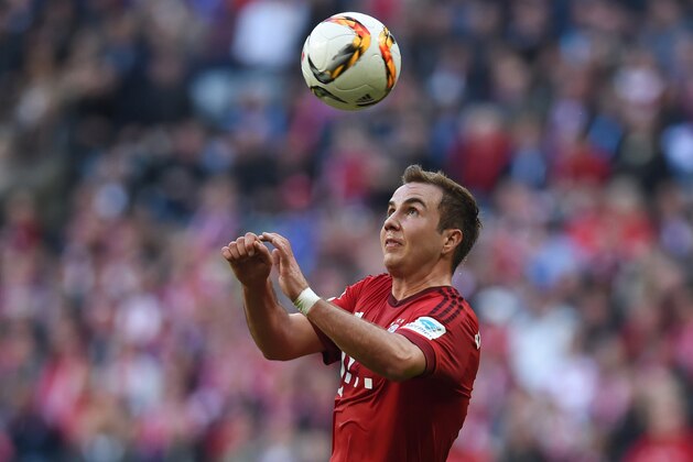 Bayern Munich's midfielder Mario Goetze heads the ball during the German first division Bundesliga football match FC Bayern Munich vs Schalke 04 in Munich, southern Germany, on April 16, 2016.
Bayern Munich won the match 3-0. / AFP / CHRISTOF STACHE / RESTRICTIONS: DURING MATCH TIME: DFL RULES TO LIMIT THE ONLINE USAGE TO 15 PICTURES PER MATCH AND FORBID IMAGE SEQUENCES TO SIMULATE VIDEO. == RESTRICTED TO EDITORIAL USE == FOR FURTHER QUERIES PLEASE CONTACT DFL DIRECTLY AT + 49 69 650050
        (Photo credit should read CHRISTOF STACHE/AFP/Getty Images)