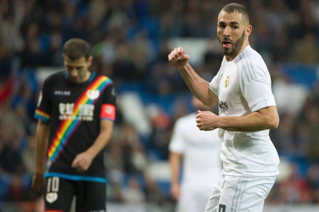 Real Madrid's French forward Karim Benzema celebrates after scoring during the Spanish league football match Real Madrid CF vs Rayo Vallecano de Madrid at the Santiago Bernabeu stadium in Madrid on December 20, 2015. Real Madrid won 10-2.   / AFP / CURTO DE LA TORRE        (Photo credit should read CURTO DE LA TORRE/AFP/Getty Images)