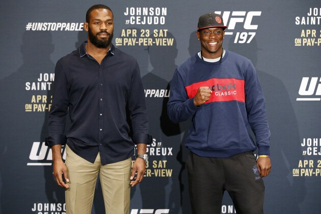 Jon Jones, left, and Ovince Saint Preux pose during a UFC 197 mixed martial arts news conference, Thursday, April 21, 2016, in Las Vegas. The two are scheduled to fight in an interim light heavyweight title bout Saturday in Las Vegas. (AP Photo/John Locher)