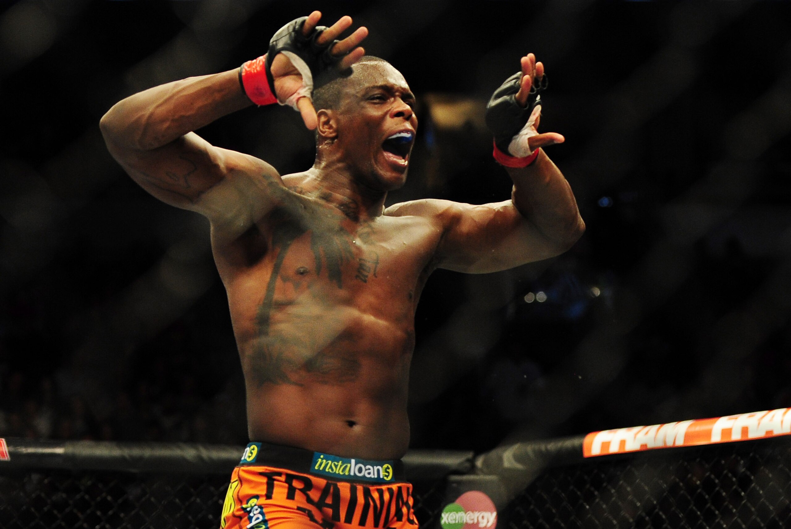 Jun 14, 2014; Vancouver, British Columbia, Canada; Ovince Saint Preux (red) reacts after defeating Ryan Jimmo (blue) in their light heavyweight bout for UFC 174 at Rogers Arena. Mandatory Credit: Anne-Marie Sorvin-USA TODAY Sports